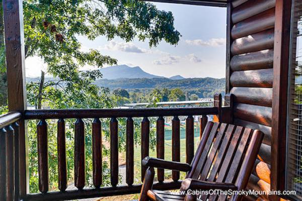 rocking chair on balcony of a log cabin