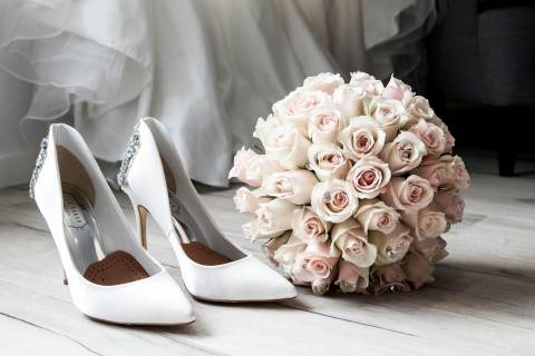 bouquet and heels next to each other for wedding photo